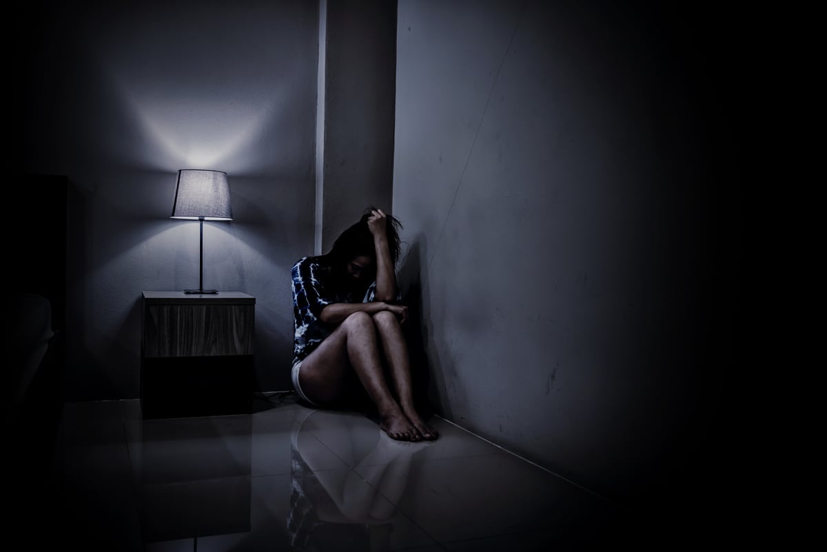 Sad Woman in a Dark Room 